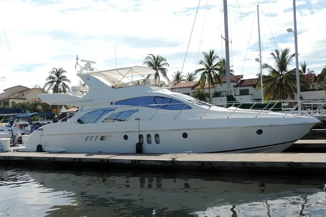 A motor yacht moored in a marina