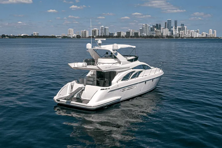The Azimut 58 Fly cruising with the city skyline behind