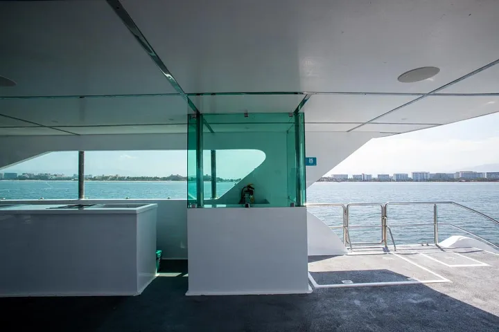 Glass-walled interior deck of Catamaran 72