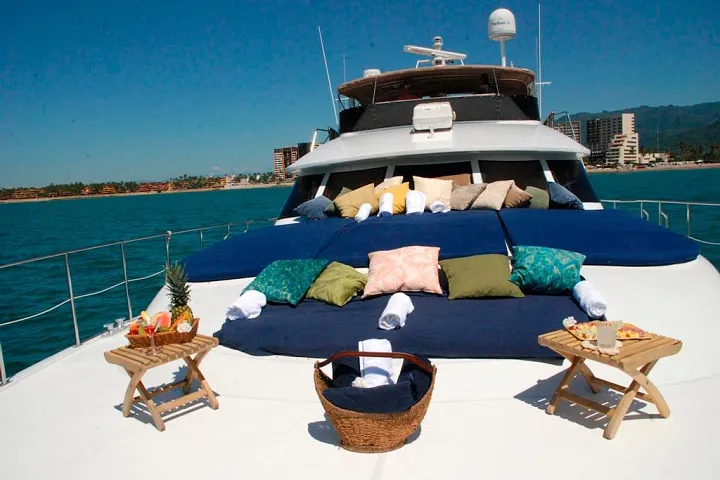 Deck lounge with cushions and chairs aboard the Custom 90