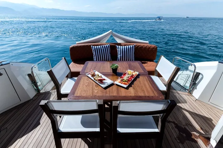 Aft dining table with a sea view aboard the Marquis 50